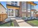Charming two-story home with modern design, large windows, and landscaped front entrance at 4211 Vallejo St, Denver, CO 80211