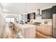 Open concept kitchen with a large center island, modern appliances, and seamless flow to the living area at 4211 Vallejo St, Denver, CO 80211