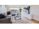 Living room featuring stylish furniture, large windows, and modern decor at 4211 Vallejo St, Denver, CO 80211