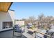 Outdoor deck showcasing a fireplace, comfortable seating, and a panoramic view at 4211 Vallejo St, Denver, CO 80211