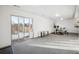 Open basement area with sliding glass doors, fitness equipment, neutral carpet and natural light, ideal for a home gym at 20054 E 48Th Dr, Denver, CO 80249