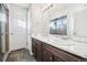 Bathroom with double sink vanity, tile flooring, and large mirror at 20054 E 48Th Dr, Denver, CO 80249