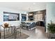 Charming kitchen featuring a large marble island, modern lighting, tile floor, and stainless steel appliances at 20054 E 48Th Dr, Denver, CO 80249