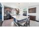 Open kitchen featuring a large marble island, modern lighting, and stainless steel appliances at 20054 E 48Th Dr, Denver, CO 80249