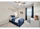 Cozy ' bedroom with a bed, seat, and toys that provides a comfortable and enjoyable space at 3086 Kestrel St, Brighton, CO 80601