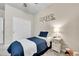 Cozy bedroom with a twin bed, a nightstand, and a wall decoration at 3086 Kestrel St, Brighton, CO 80601
