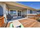 Spacious covered patio deck with a grill and outdoor storage, perfect for entertaining and relaxing at 3086 Kestrel St, Brighton, CO 80601