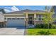 Charming single-story home with stone accents, well-maintained lawn, and attached two-car garage at 3086 Kestrel St, Brighton, CO 80601