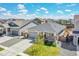 Charming single-Gathering home featuring stone accents, a well-manicured lawn, and a two-car garage at 3086 Kestrel St, Brighton, CO 80601