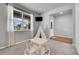 Bright playroom featuring modern decor and large windows for ample natural light at 3086 Kestrel St, Brighton, CO 80601