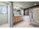 Elegant bathroom with double vanity and soaking tub at 4942 S Zephyr St, Littleton, CO 80123