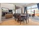 Bright dining room with hardwood floors and patio access at 4942 S Zephyr St, Littleton, CO 80123