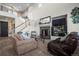 Living room with high ceilings, fireplace and large windows at 4942 S Zephyr St, Littleton, CO 80123