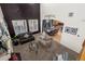 Open living room with high ceilings, looking toward kitchen and dining area at 4942 S Zephyr St, Littleton, CO 80123