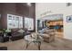 Spacious living room with high ceilings and a view into the kitchen at 4942 S Zephyr St, Littleton, CO 80123