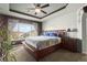 Large main bedroom with ample natural light and decorative wall accents at 4942 S Zephyr St, Littleton, CO 80123