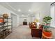 Open basement area with neutral carpet, recessed lighting, and two armchairs at 12610 E Wesley Pl, Aurora, CO 80014