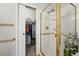 Bright bathroom featuring a glass-enclosed shower with gold trim and a walk-in closet at 12610 E Wesley Pl, Aurora, CO 80014