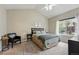 Well-lit bedroom with neutral paint, comfortable furnishings, and a relaxing atmosphere at 12610 E Wesley Pl, Aurora, CO 80014