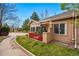 Single story home featuring a private side porch with awning and a small red fence at 12610 E Wesley Pl, Aurora, CO 80014