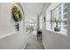 Well-lit hallway featuring neutral walls and carpet flooring at 12610 E Wesley Pl, Aurora, CO 80014