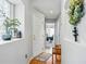 Bright hallway with hardwood floors and decorative accents at 12610 E Wesley Pl, Aurora, CO 80014