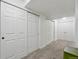 Carpeted hallway with white trim, recessed lighting, and multiple closet doors at 12610 E Wesley Pl, Aurora, CO 80014