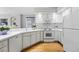 Well-maintained kitchen with white cabinets and hardwood flooring at 12610 E Wesley Pl, Aurora, CO 80014