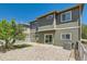 Charming outdoor space features a brick patio and well-maintained lawn, perfect for relaxing or entertaining at 14183 Madison Way, Thornton, CO 80602