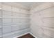 Walk-in closet with custom shelving for optimal storage at 14183 Madison Way, Thornton, CO 80602
