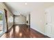 Bright open-concept living space flows to the kitchen, offering hardwood floors and access to a patio at 14183 Madison Way, Thornton, CO 80602