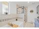 Beautiful bathroom with a soaking tub, a separate walk-in shower, and a stylish vanity with modern fixtures at 1475 Kingsbury Ct, Golden, CO 80401