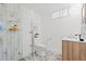 Stylish bathroom featuring a glass shower, decorative tile floor, and modern sink vanity at 1475 Kingsbury Ct, Golden, CO 80401