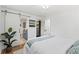 Bedroom with a barn door, natural light and access to an ensuite bathroom at 1475 Kingsbury Ct, Golden, CO 80401