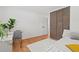 Neutral toned bedroom featuring closet with sliding doors, a desk and natural light at 1475 Kingsbury Ct, Golden, CO 80401