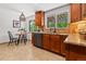 Eat-in kitchen area with wood cabinets, granite countertops, stainless steel appliances, with a view to the outside at 1475 Kingsbury Ct, Golden, CO 80401