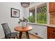 Bright kitchen nook featuring natural light, a modern light fixture, and a cozy seating area at 1475 Kingsbury Ct, Golden, CO 80401