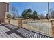 Spacious outdoor deck with wooden flooring and railing system overlooking a green space at 19551 E Mann Creek Dr # B, Parker, CO 80134