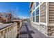 Open-air deck with stone pillars and railing system overlooking the street at 19551 E Mann Creek Dr # B, Parker, CO 80134