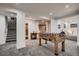 Finished basement area featuring gray carpet, foosball table, and an open layout for flexible use at 19551 E Mann Creek Dr # B, Parker, CO 80134