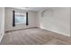 Finished basement featuring neutral carpet, a window, and neutral paint at 19551 E Mann Creek Dr # B, Parker, CO 80134