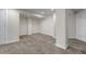 Spacious finished basement with neutral carpet, white walls, and recessed lighting at 19551 E Mann Creek Dr # B, Parker, CO 80134