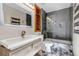 Modern bathroom featuring a vessel sink, wood-look vanity and medicine cabinet, and a glass-enclosed shower over tub at 19551 E Mann Creek Dr # B, Parker, CO 80134