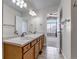 Bathroom with double sink vanity, neutral colors, and tile floor at 19551 E Mann Creek Dr # B, Parker, CO 80134