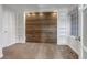 Bedroom with custom shelves and wood paneling at 19551 E Mann Creek Dr # B, Parker, CO 80134