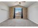 Bright bedroom with an arched window and stone accent wall at 19551 E Mann Creek Dr # B, Parker, CO 80134