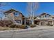 Inviting townhouse exterior with manicured landscaping, stone accents, and private balconies at 19551 E Mann Creek Dr # B, Parker, CO 80134