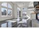 Bright living room with high ceilings and large windows creating a light-filled space at 19551 E Mann Creek Dr # B, Parker, CO 80134