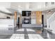 Spacious living room boasting hardwood floors, fireplace and view of the open concept kitchen at 19551 E Mann Creek Dr # B, Parker, CO 80134