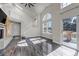 Bright living room features vaulted ceilings, large windows and a door leading to the deck at 19551 E Mann Creek Dr # B, Parker, CO 80134